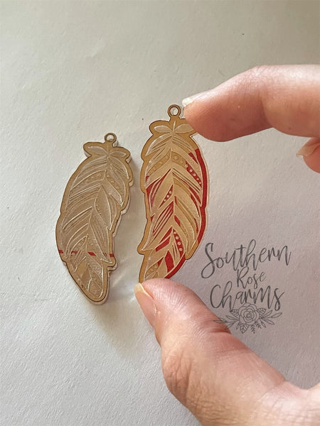 Detailed feather earrings